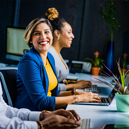 woman smiling at computer